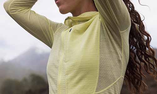 woman wearing icebreaker merino descender hoodie