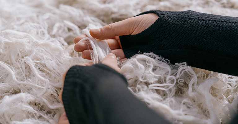 person handling icebreaker merino wool