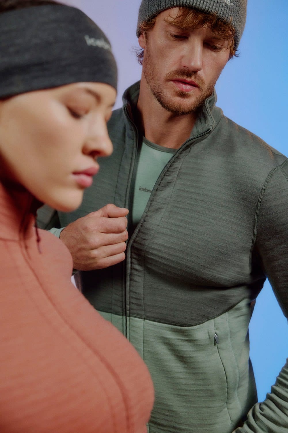 Man and woman wearing icebreaker 400 descender merino zip jacket