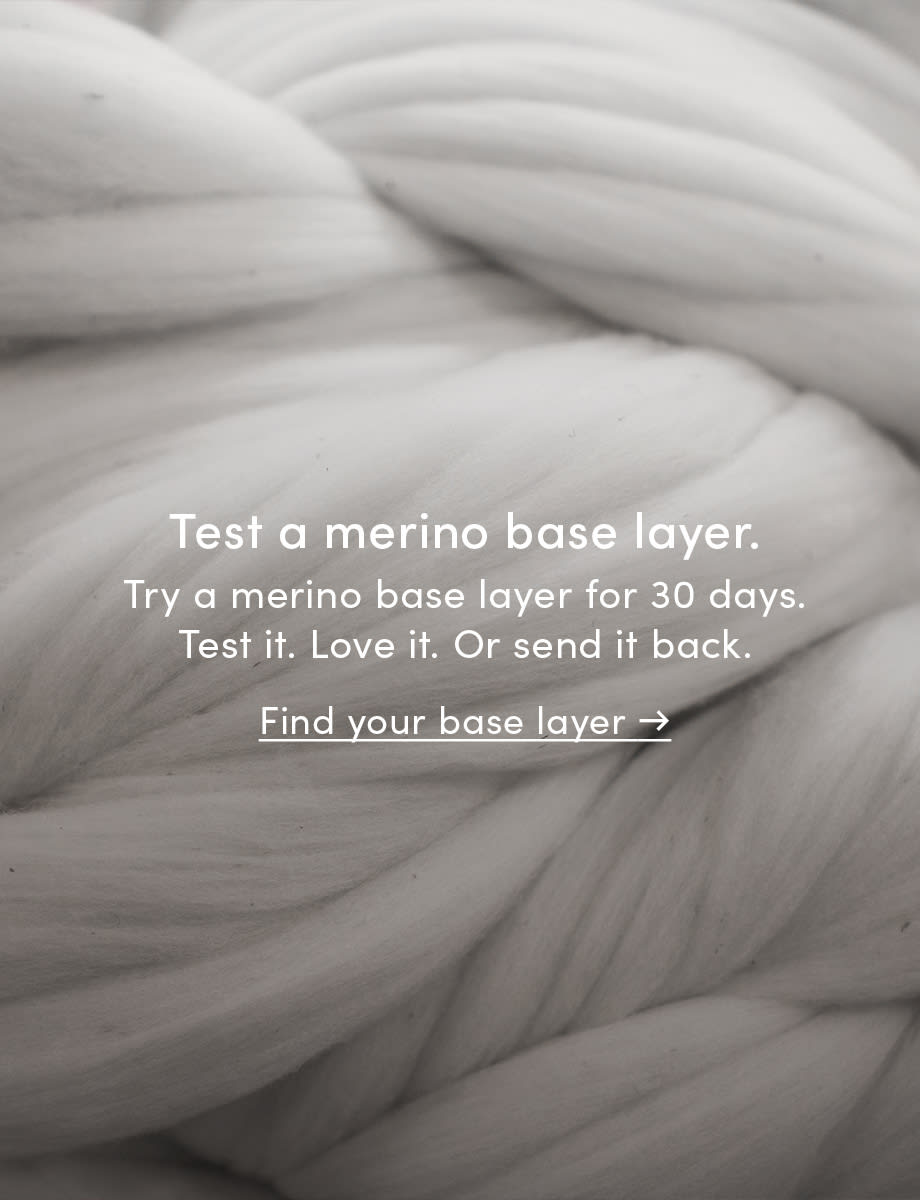 Image depicts a macro shot of white merino wool fiber.