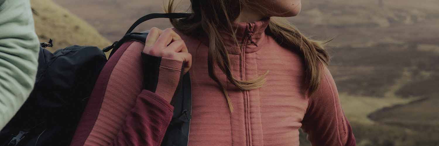 woman wearing icebreaker descender merino full zip sweatshirt