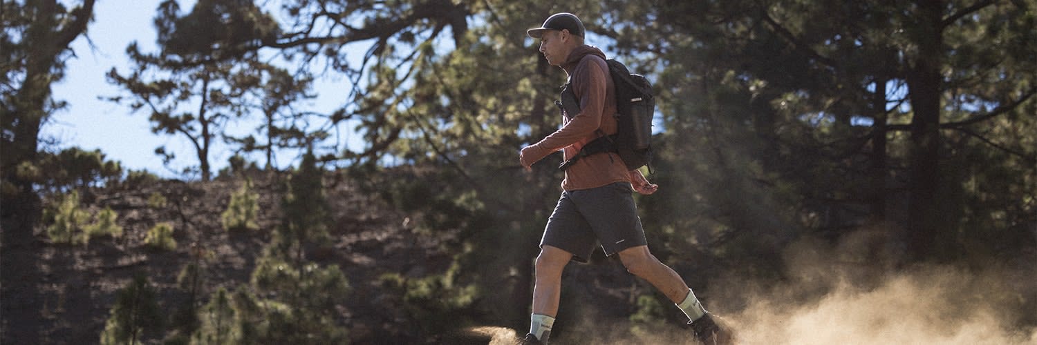 Man hiking wearing icebreaker sphere merino t-shirt