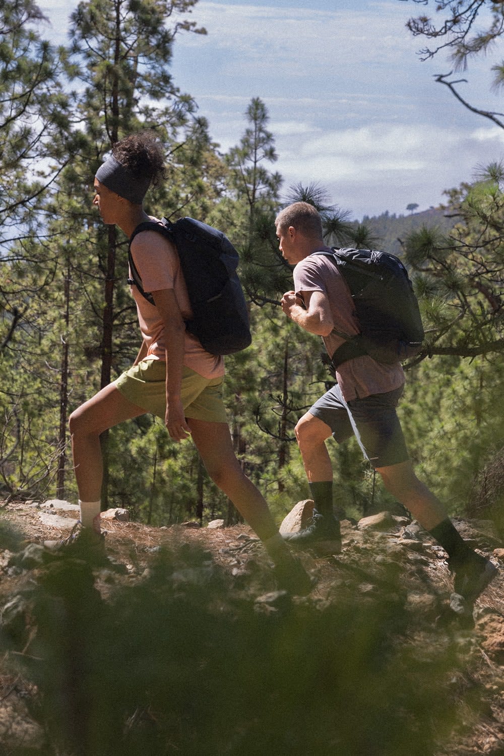 Two people hiking wearing icebreaker sphere merino t-shirts and merino hiking shorts