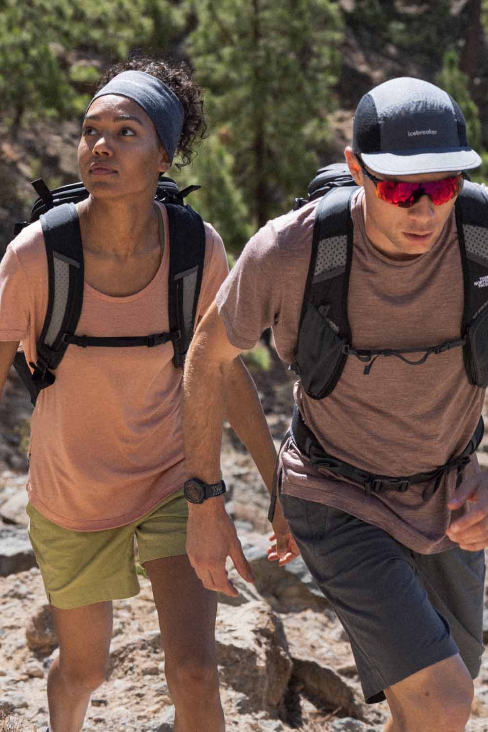 Man and woman hiking wearing icebreaker merino sphere t-shirt