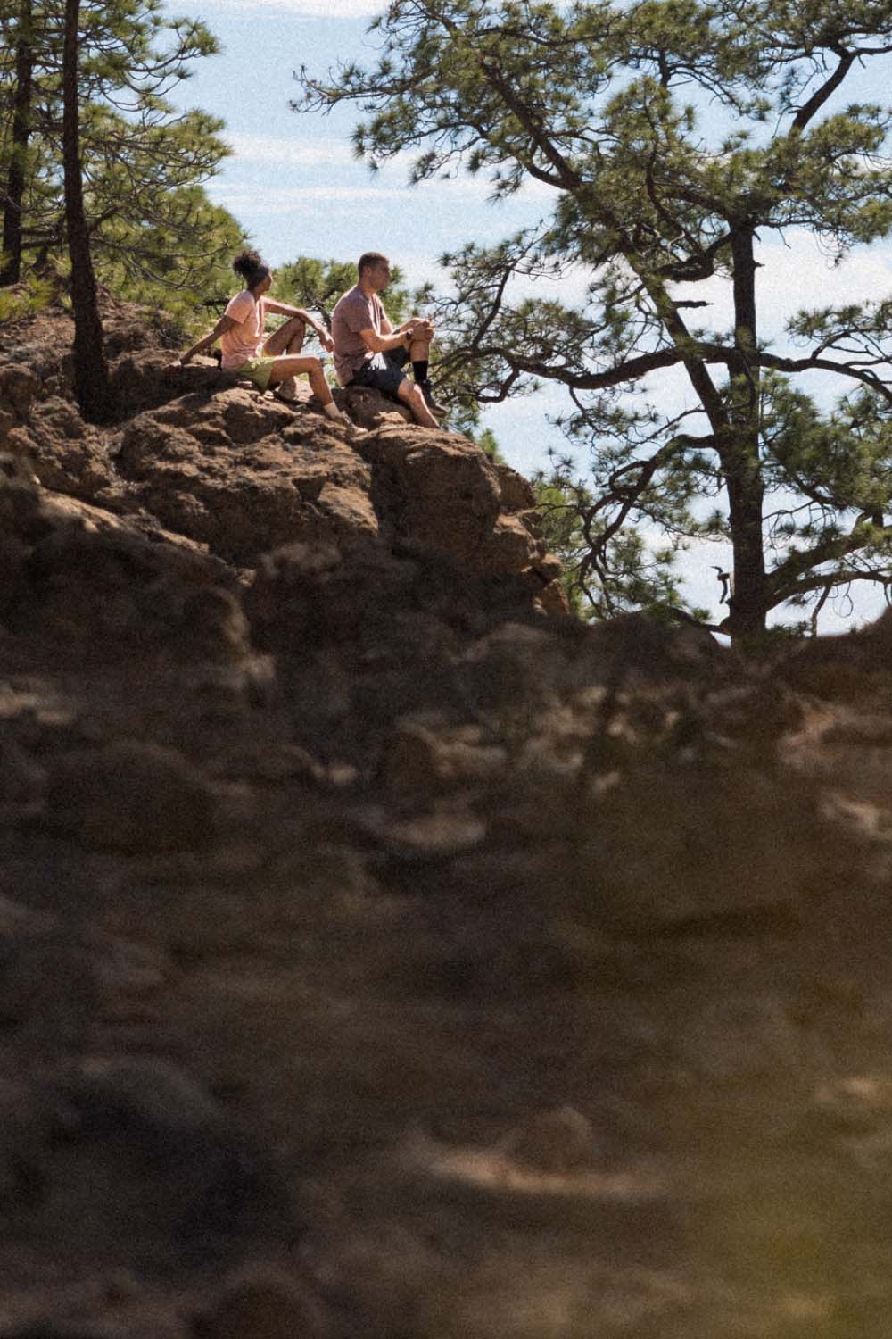 Two people hiking in summer wearing icebreaker merino sphere t-shirts