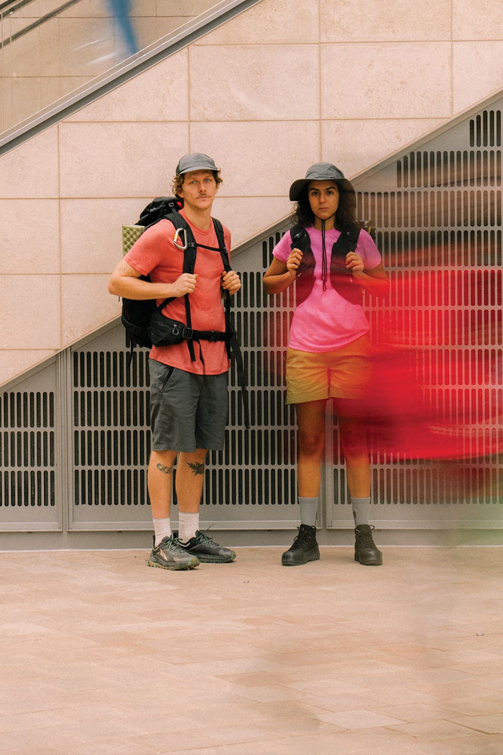 Two people traveling in icebreaker gear.