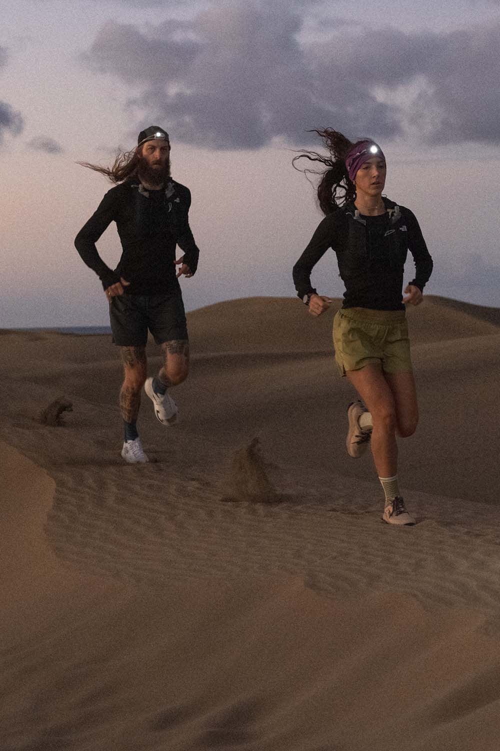 Two people running wearing icebreaker merino featherlight long sleeve tops