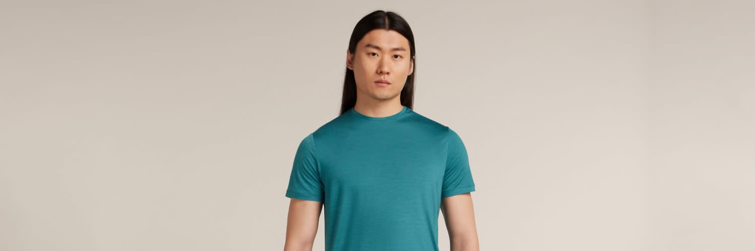 Man wearing icebreaker sphere merino t-shirt