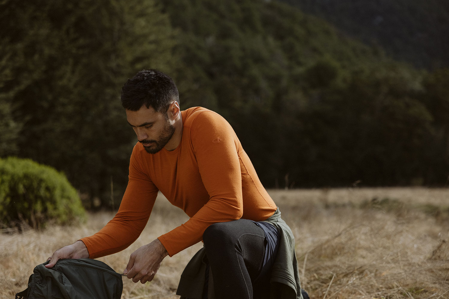 man wearing Merino 200 Oasis Long Sleeve Crewe Thermal Top base layer