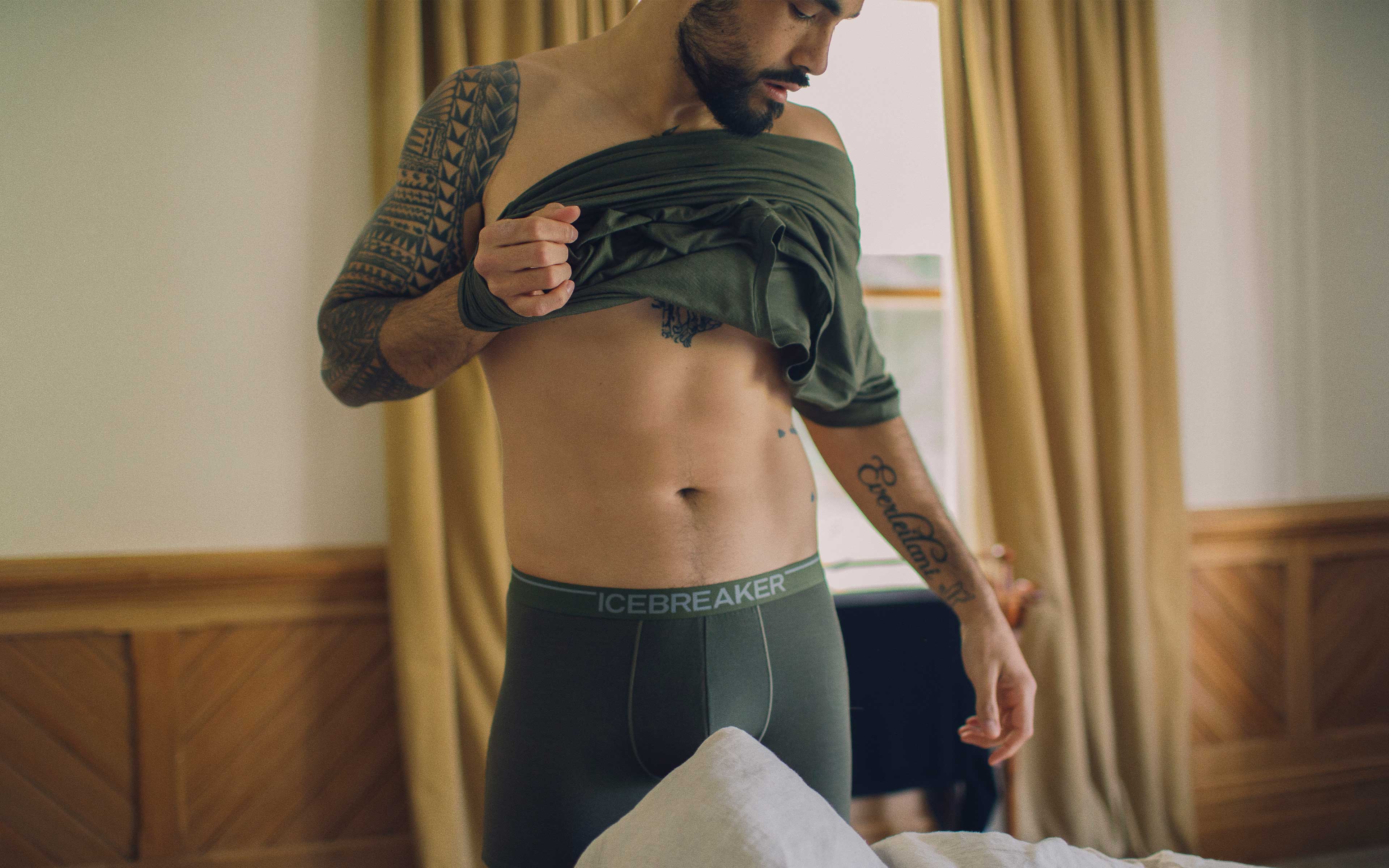 Man wearing Men's Merino Anatomica Boxers in Loden colour underwear