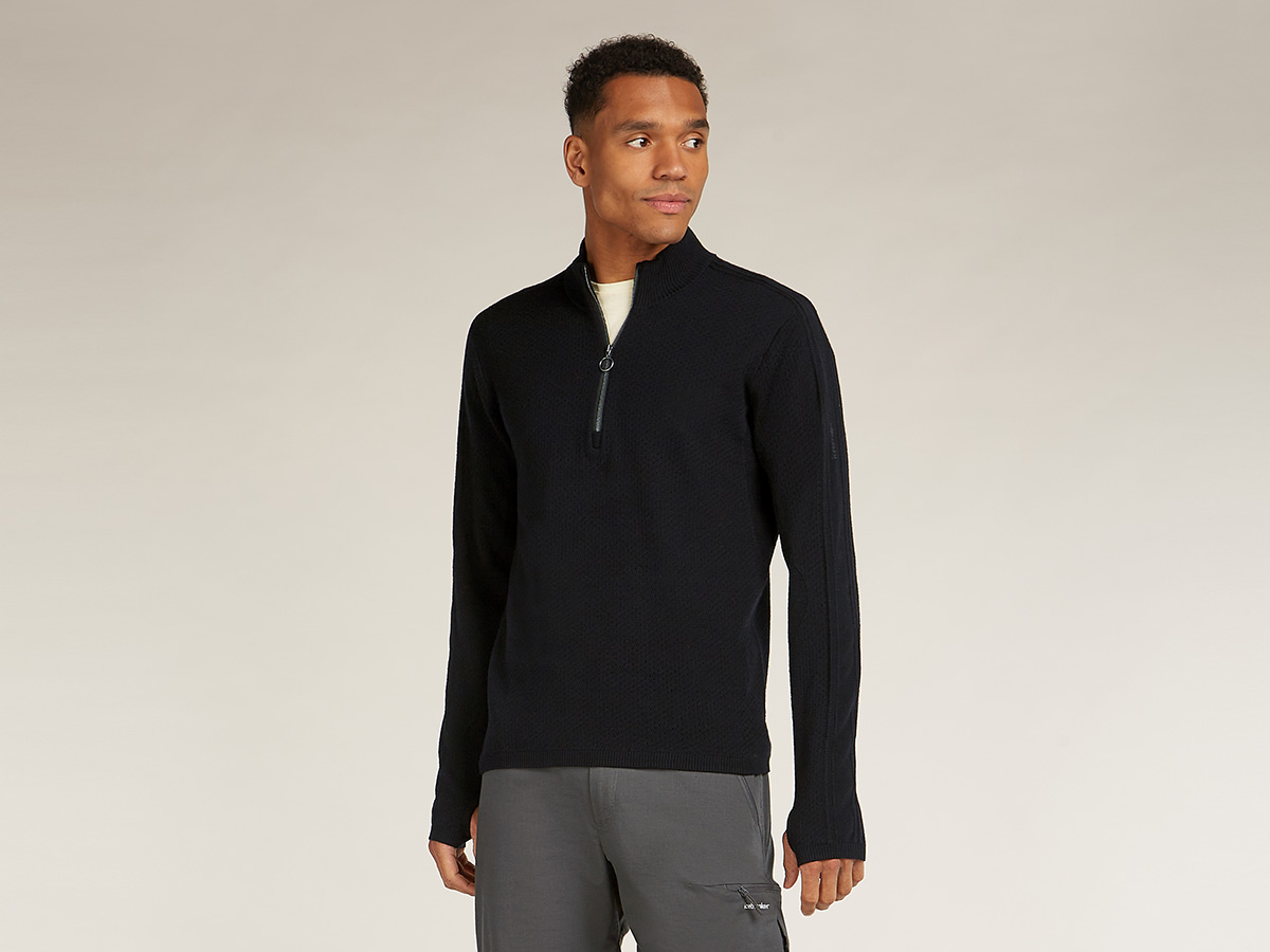 Man wearing an icebreaker half zip merino sweater